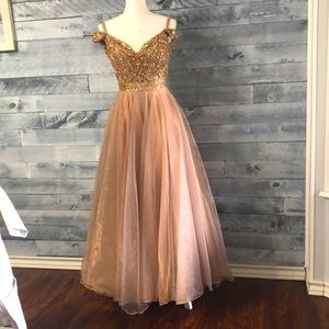 Champagne Sherri Hill Prom dress. This dress has a lot of beading on the bodice.